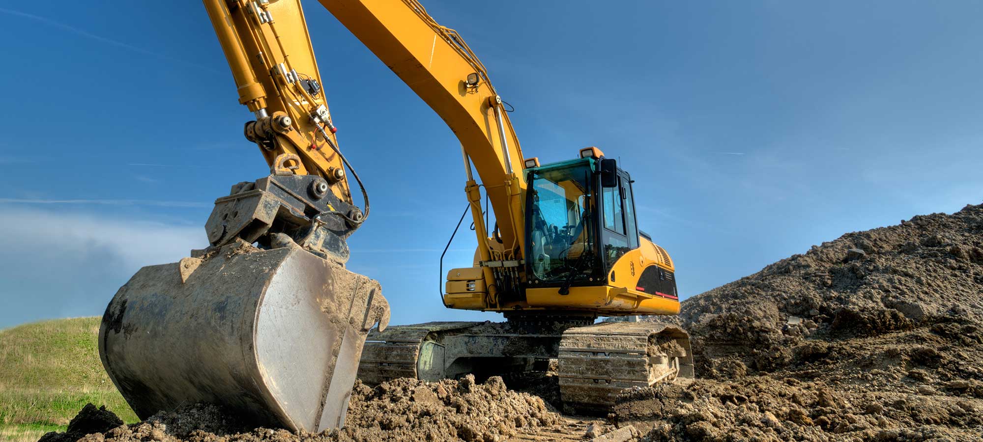 Backhoe Digging Dirt